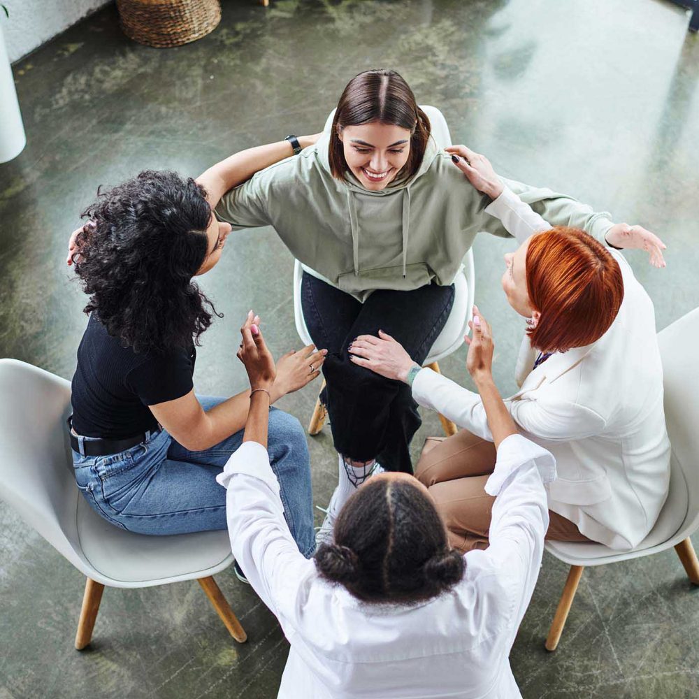 high-angle-view-of-motivation-coach-and-optimistic-T2UP57V